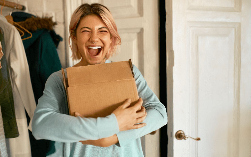 Woman delighted with her energy-saving kit
